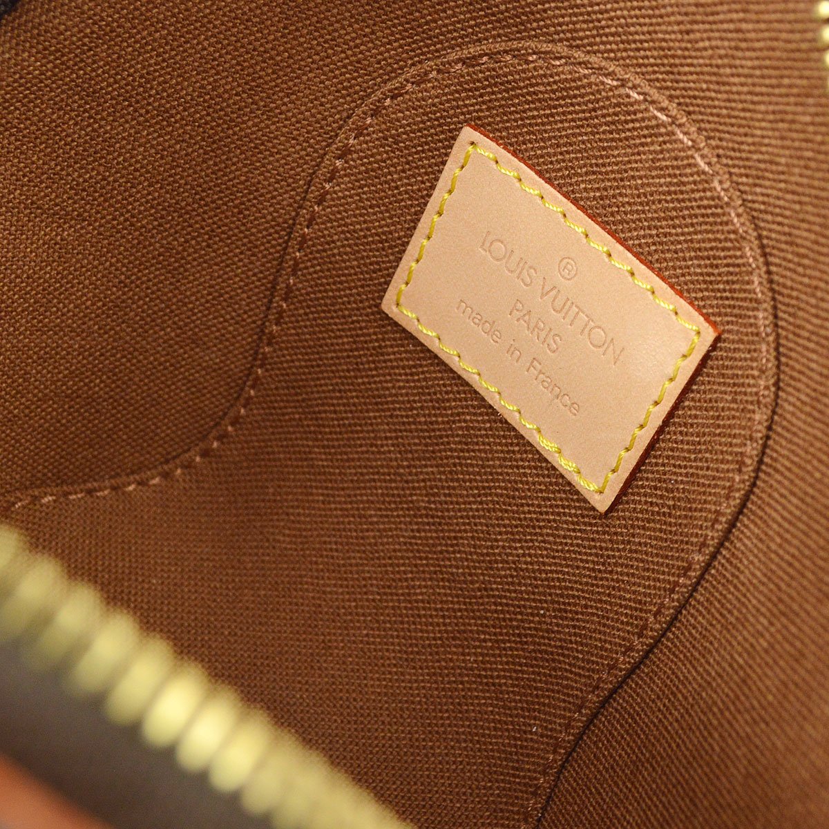 Louis Vuitton 2005 pre-owned monogram mini Ellipse pouch - ShopStyle  Clutches
