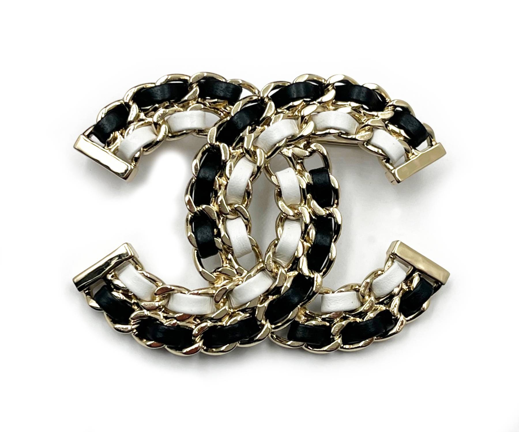 Chanel shop brooch leather