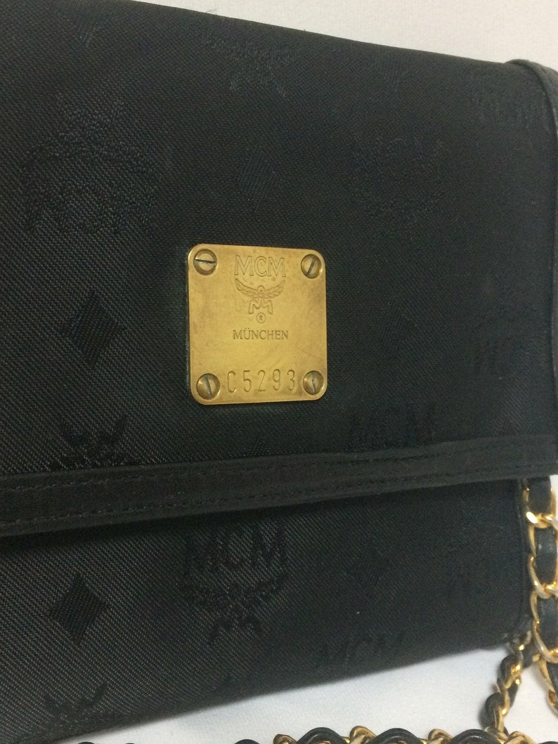 Mcm black 2024 clutch bag