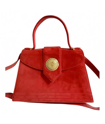 YVES SAINT LAURENT Vintage red suede handbag with golden round logo motif and YSL embossed brass