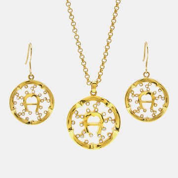 AIGNER Gold Tone Crystal Embedded Logo Pendant Necklace & Earrings Set